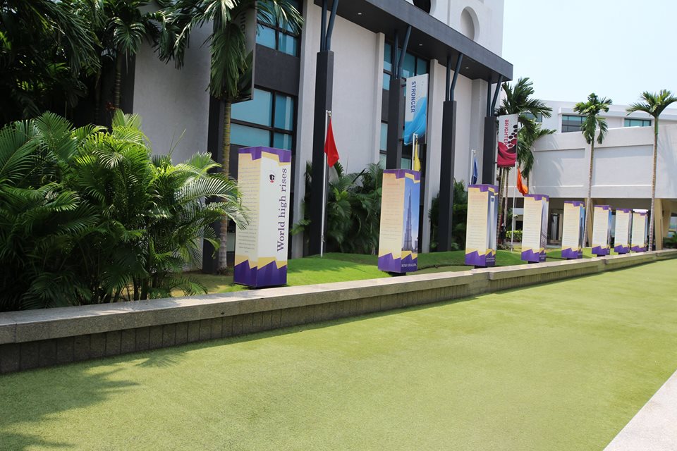 School building with students and parents visiting campus